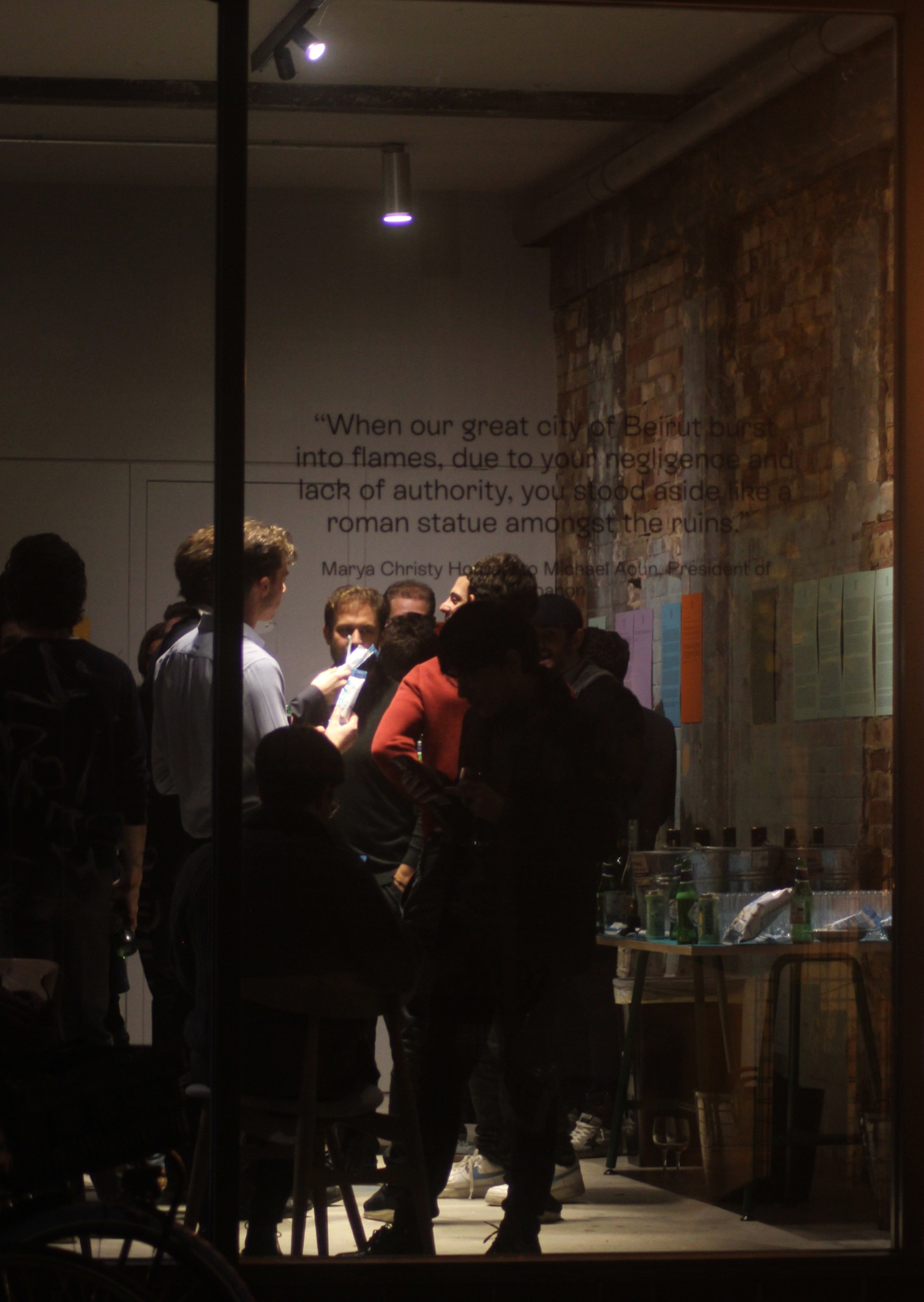Mission posters on brick wall
