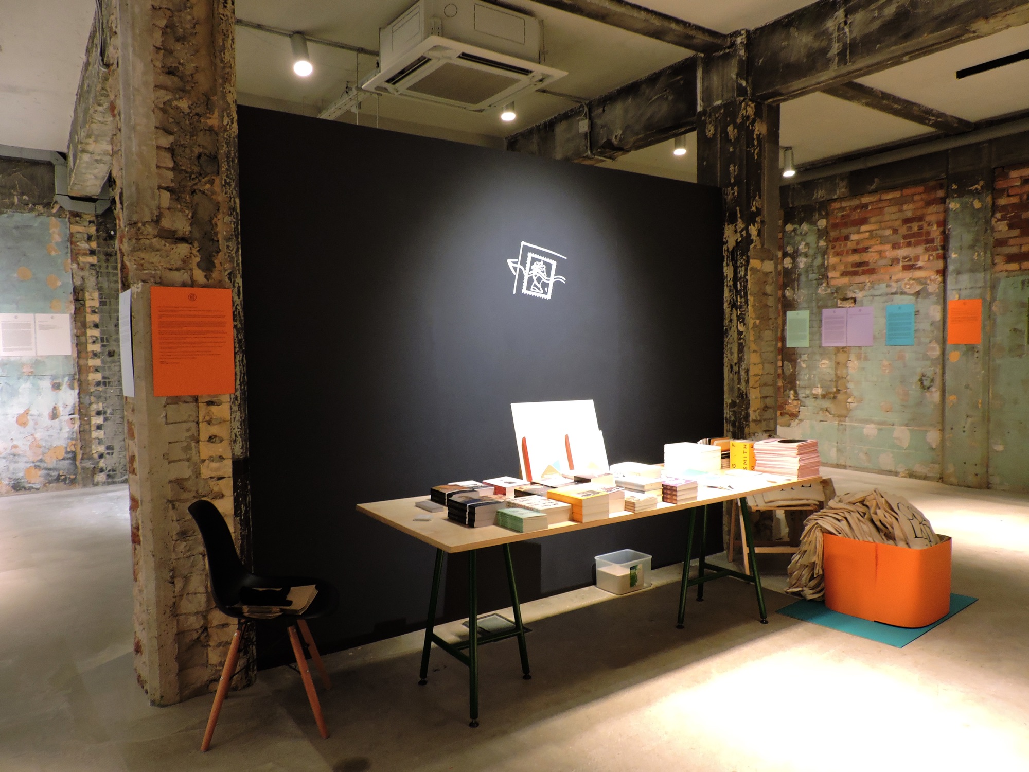 Visitors reading letters on the wall